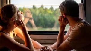 Couple enjoying romantic train trip